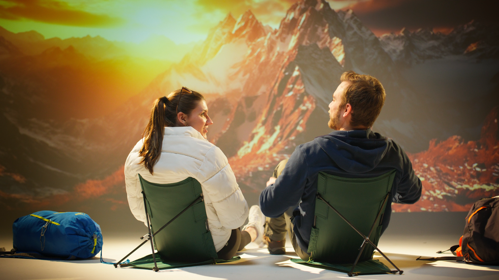Couple filming animated explainer video in studio with mountain background