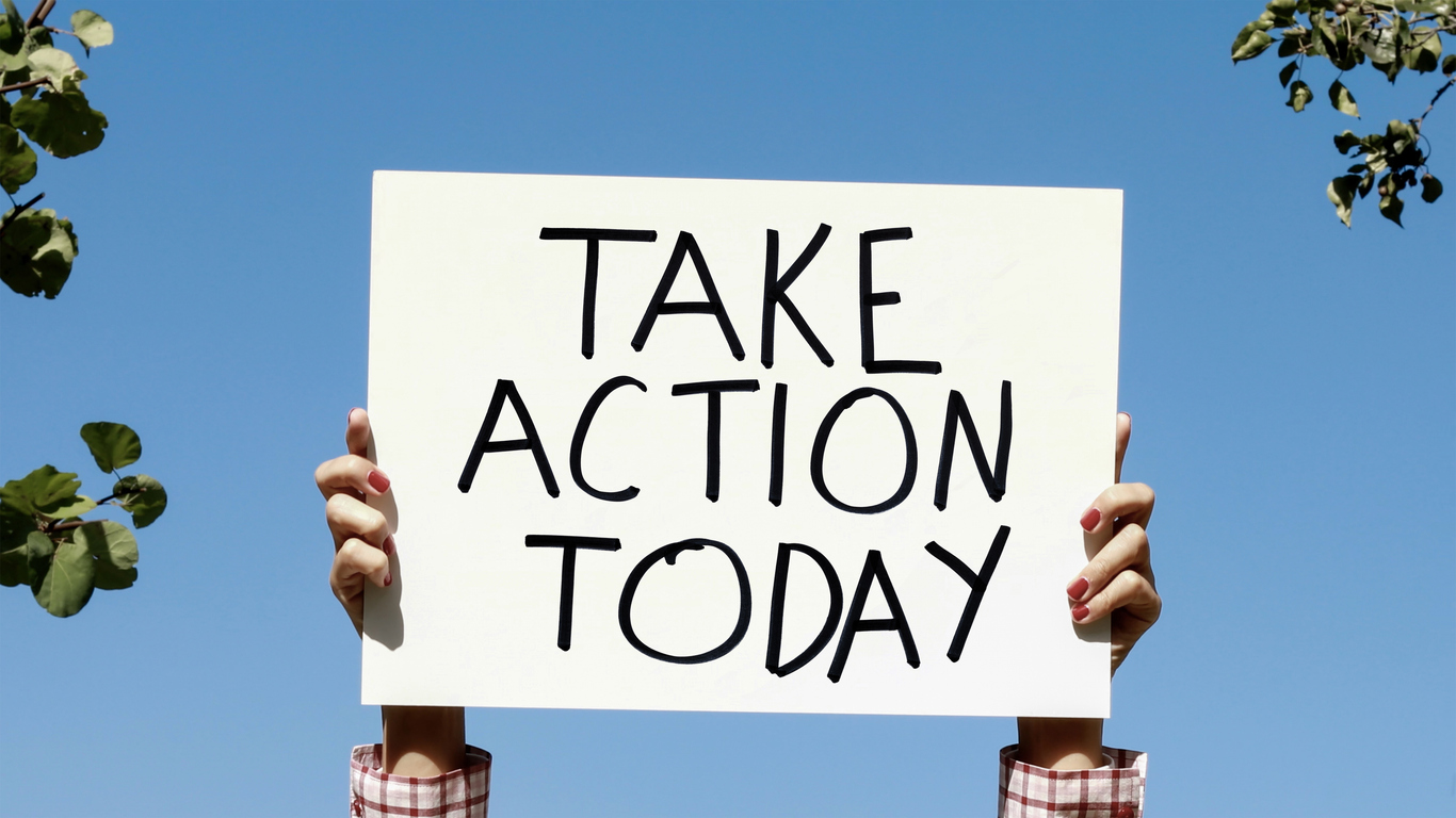 Person holding 'Take Action Today' sign representing strong call to action for explainer videos