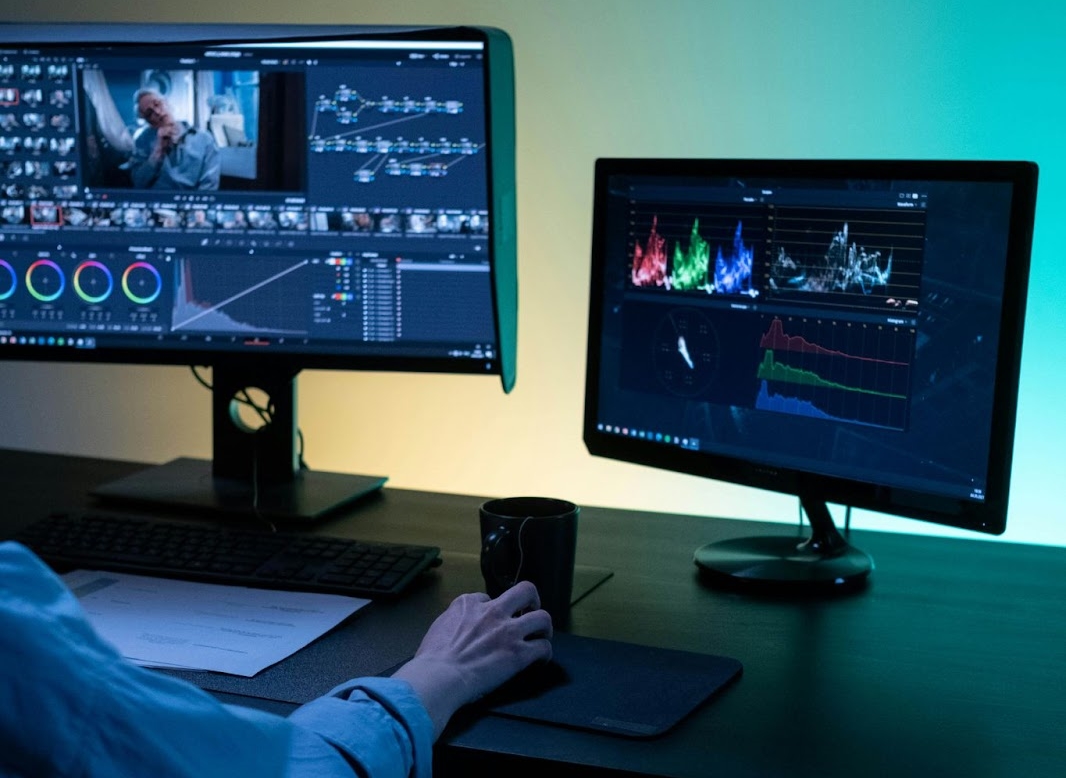 Professional color grading workspace with dual monitors for advanced video editing techniques