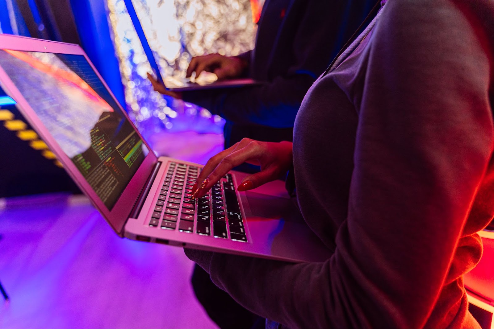 Video editing professionals working on color grading and cinematography in a creative, tech-inspired workspace