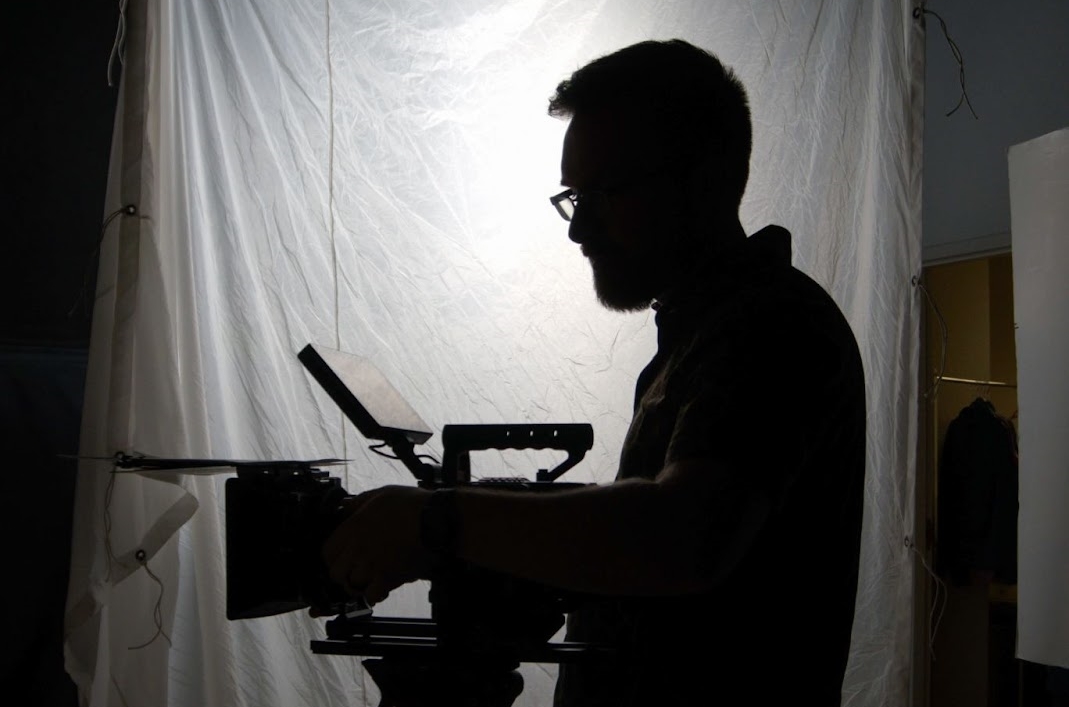 Professional videographer preparing for color grading and cinematic video production