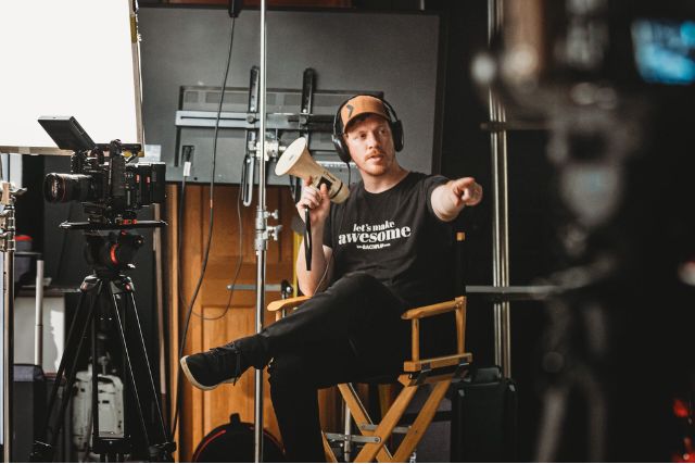 Backflip director leads a video production shoot, representing full-service offerings like brand videos, live streaming, promotional videos, and social media content