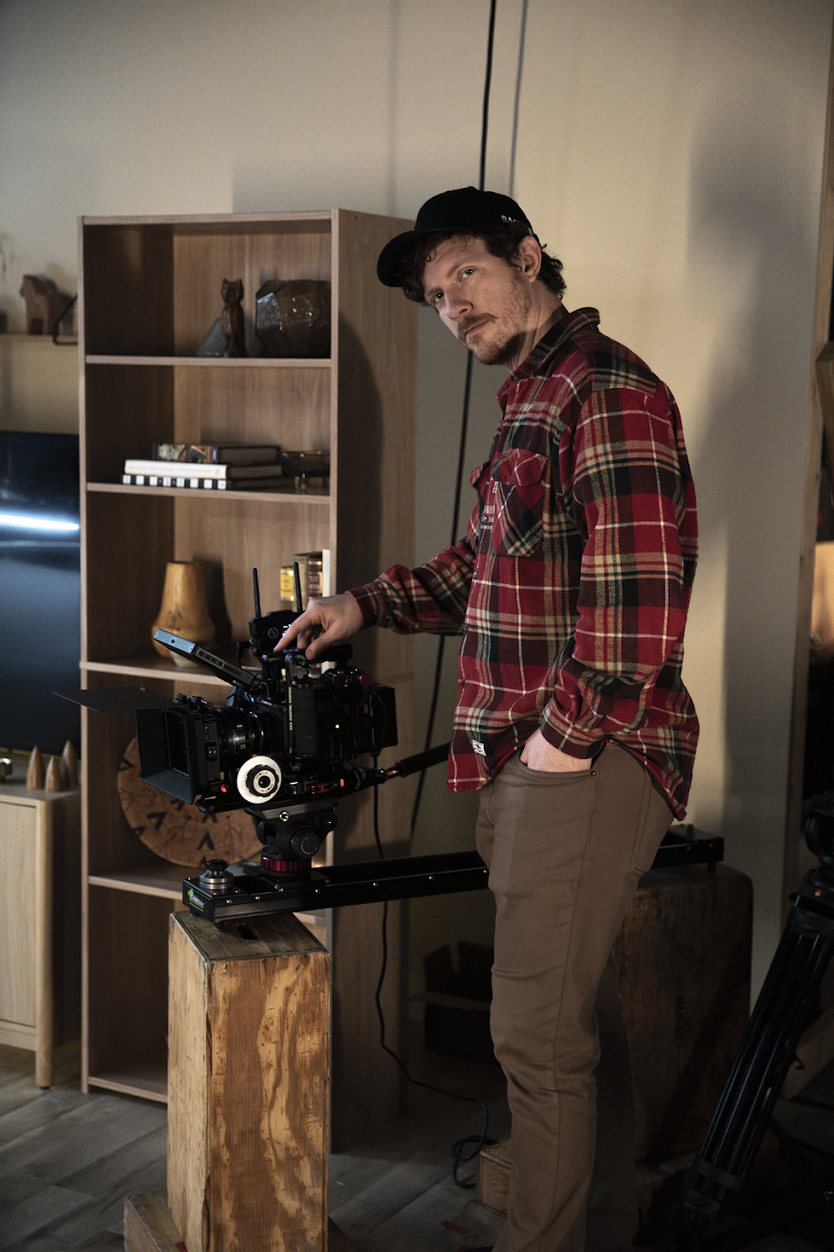John, Backflip's co-owner and director, is recording a commercial on a cinematic camera in a behind-the-scenes picture.